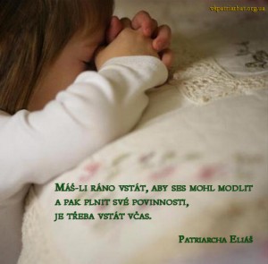 Child praying by bedside